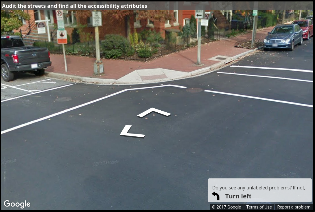 A Street View image of a corner with only one curb ramp