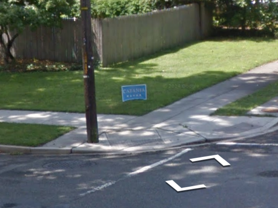 A Street View image of a pole almost entirely out of the path, but it is still located in the ramp