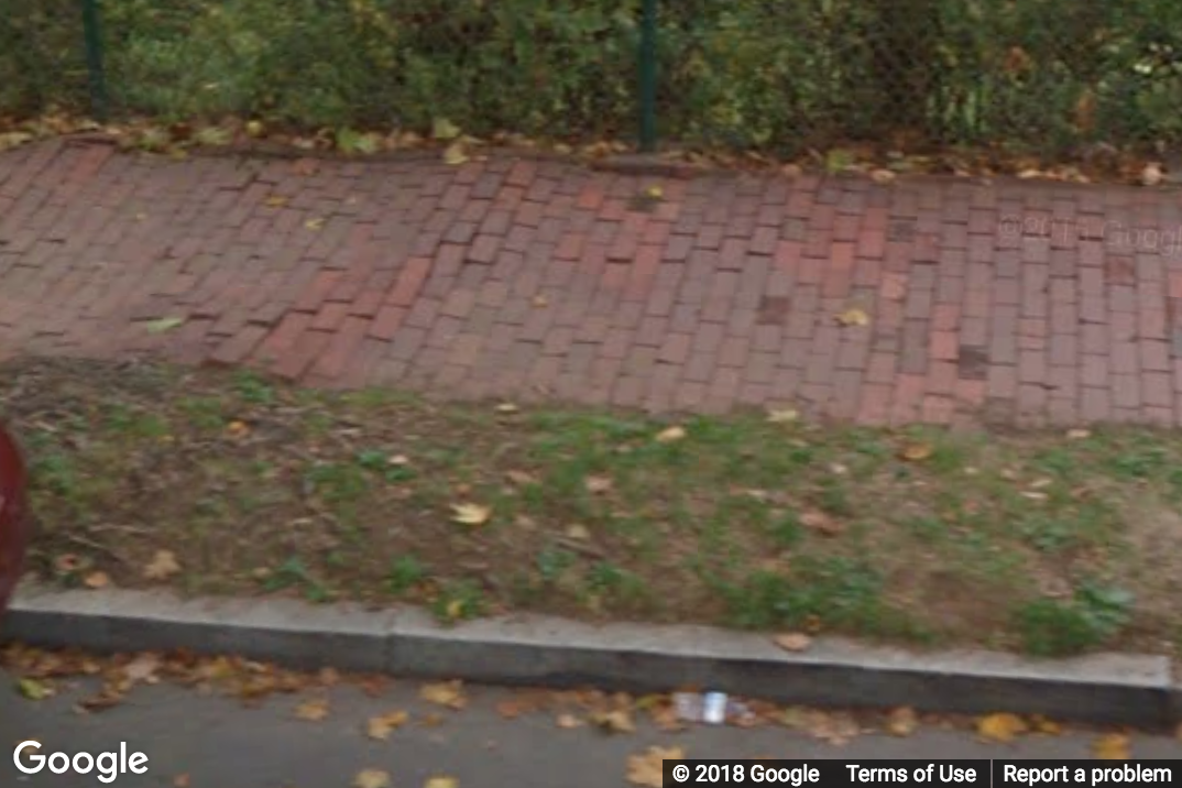 A Street View image of a brick sidewalk